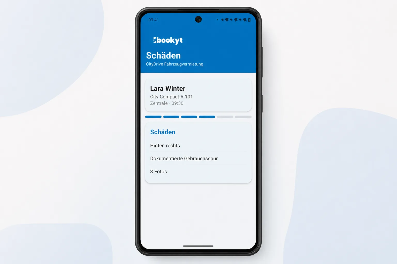 Schadensdokumentation mit Position, Beschreibung und Fotos in der Bookyt App in einem Android-Smartphone-Rahmen